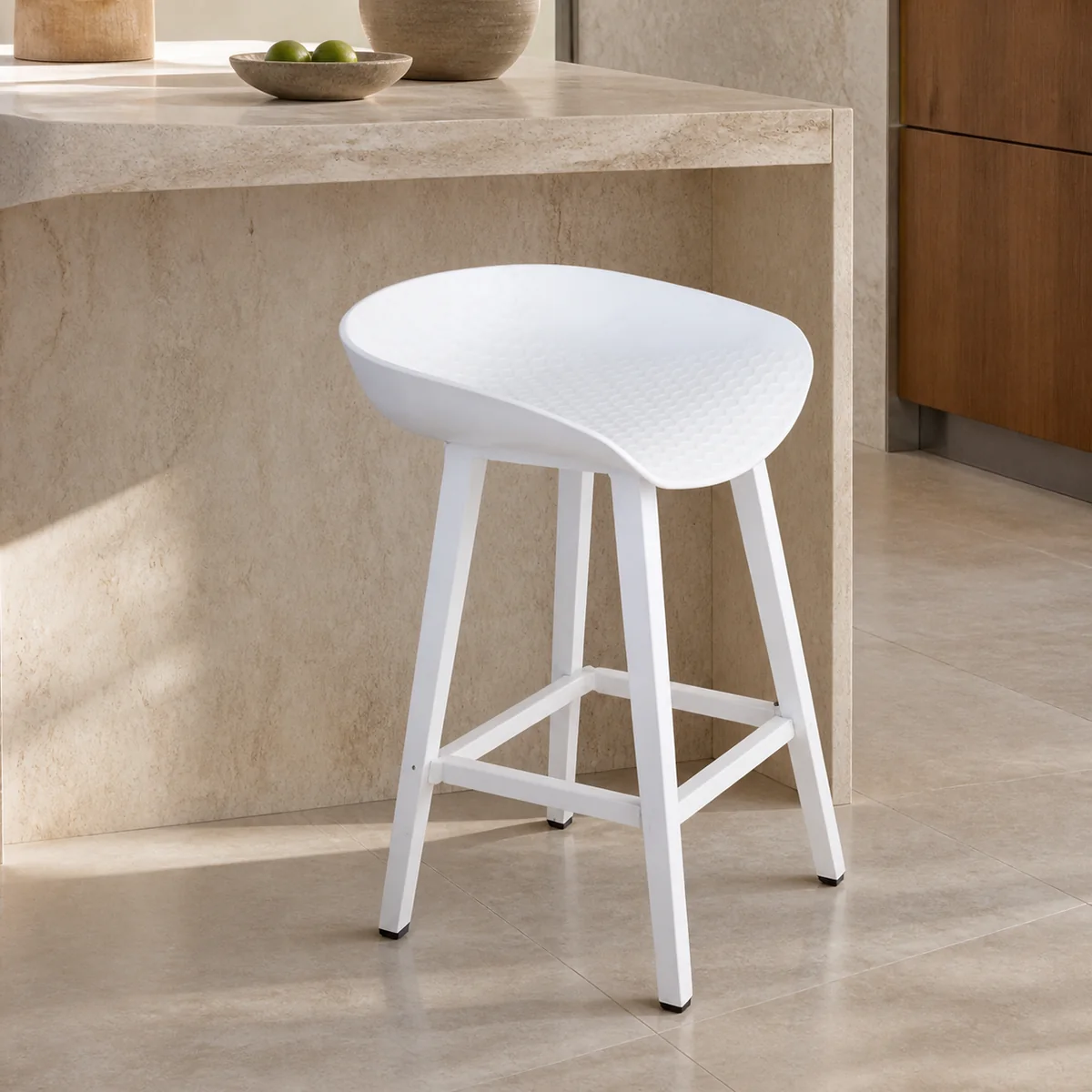 Swakop Rounded Bar Stool staged in a bright kitchen island.