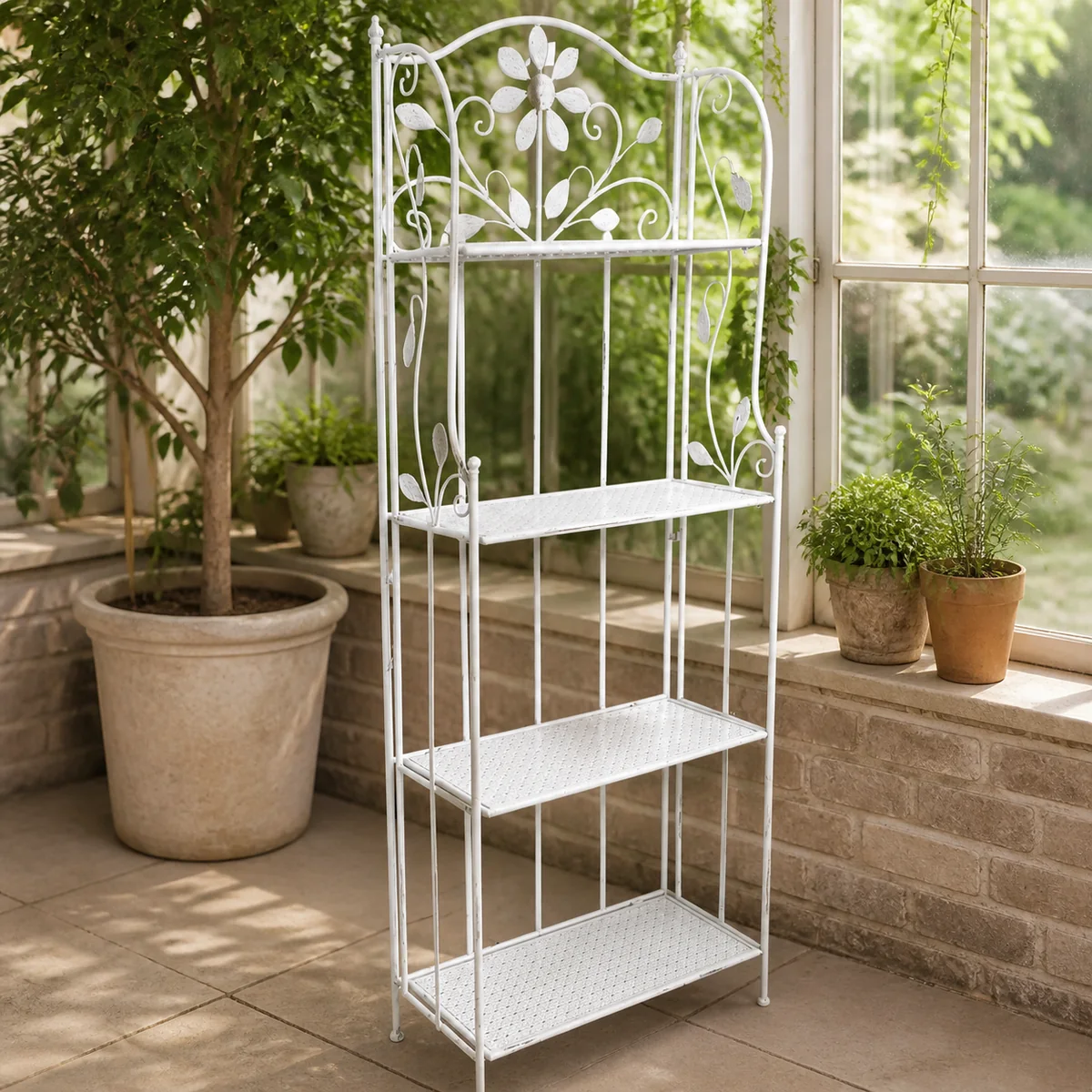 Ombili Floral Plant Stand staged in a bright conservatory.